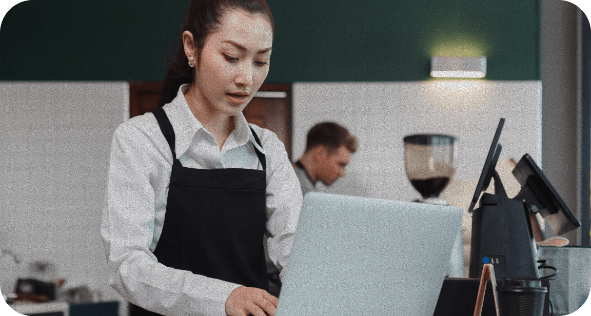 A woman struggling with a messy pile of menus